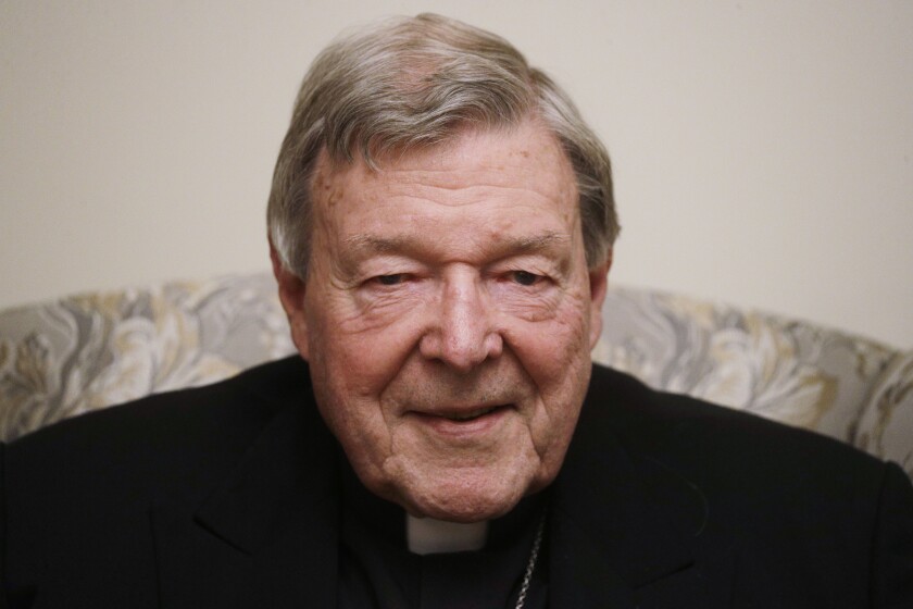 FILE - In this Nov. 30, 2020, file photo, Cardinal George Pell poses for a picture during an interview with the Associated Press inside his residence near the Vatican in Rome. Australian media companies admitted in court Monday, Feb. 1, 2021, they breached a gag order in publishing references to Cardinal George Pell’s since-overturned convictions in 2018 for child sexual abuse. The plea agreement avoids any journalist being sent to prison.(AP Photo/Gregorio Borgia, File)