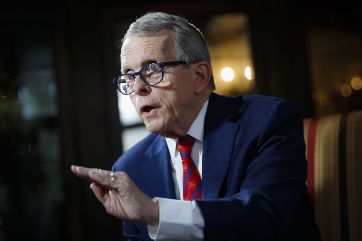FILE - In this Dec. 13, 2019, file photo, Ohio Gov. Mike DeWine speaks during an interview at the Governor's Residence in Columbus, Ohio. The Ohio governor's positive, then false, results on COVID-19 tests threw fuel on the fire for skeptics about pandemic precautions and critics of the often-aggressive policies the governor championed. (AP Photo/John Minchillo, File)
