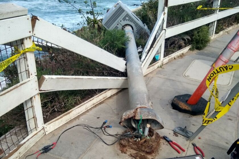 The fallen light pole near La Jolla Cove that was knocked over during a recent storm.