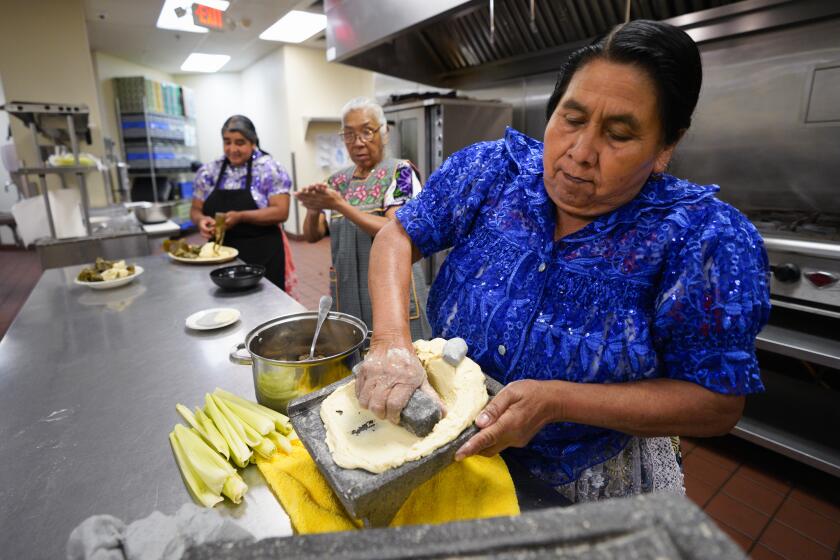 San Diego, CA - May 03: San Diego, CA - May 03: On Friday, May 3, 2024 in San Diego, CA, Juanita Bravo Lazaro (r), Maria Ines Dimas Carlos (m) and Benedicta Alejo Vargas (l) used fresh maize to prepare gortitas de frijol. The specialty is from Michoacan, Mexico and part of UNESCO Ancestral Maize Festival: Celebrating Cuisine from Michoacan, Mexico. (Nelvin C. Cepeda / The San Diego Union-Tribune)