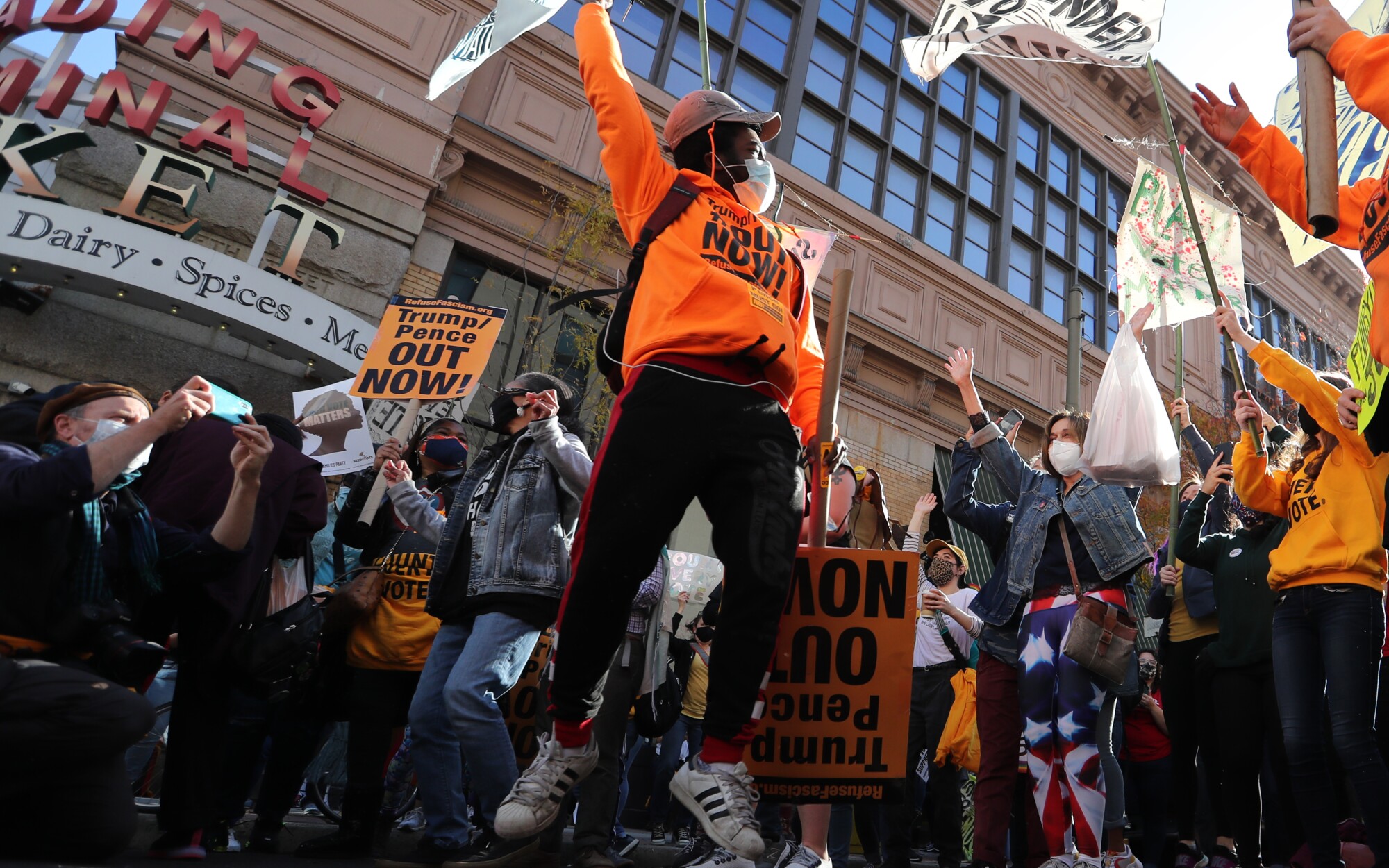 Anti-Trump protesters rally outside the Pennsylvania Convention Center in Philadelphia as vote counting continues.