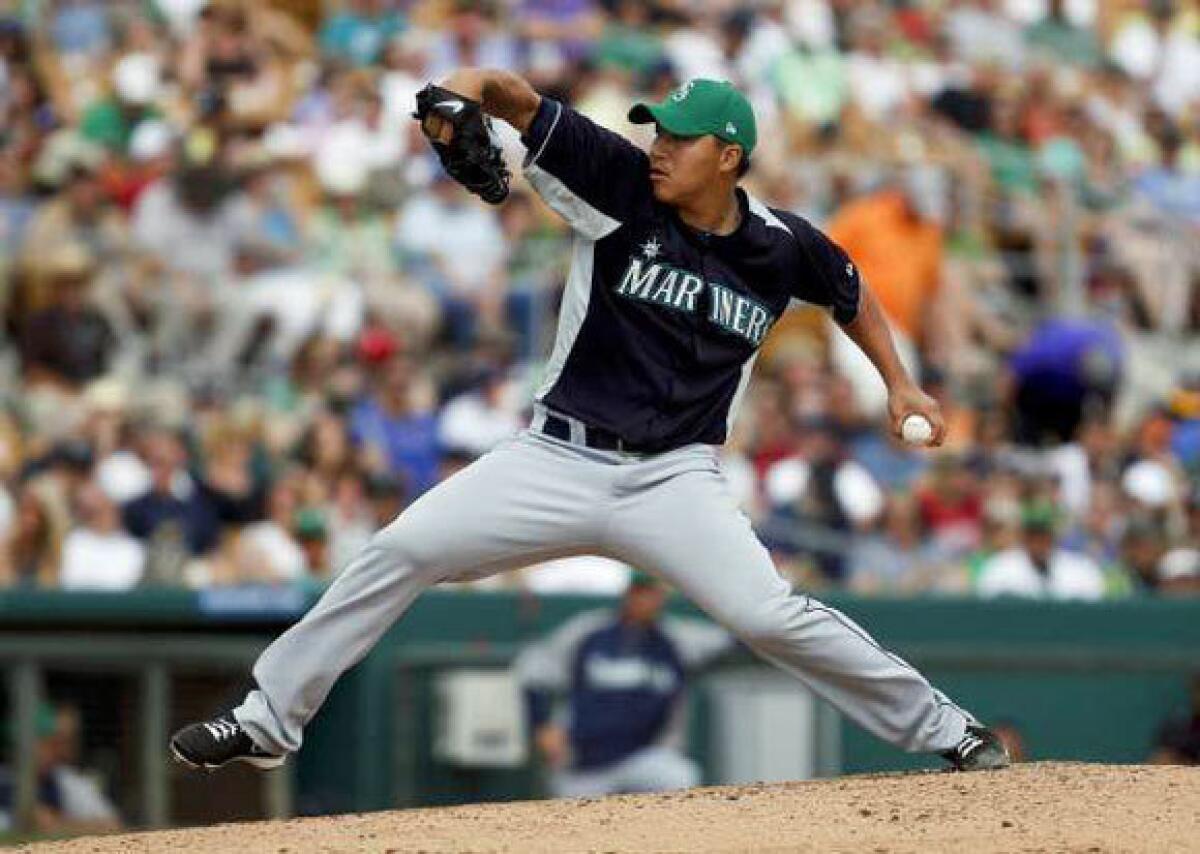 Hong-Chih Kuo during a St. Patrick's Day spring training game with the Seattle Mariners.