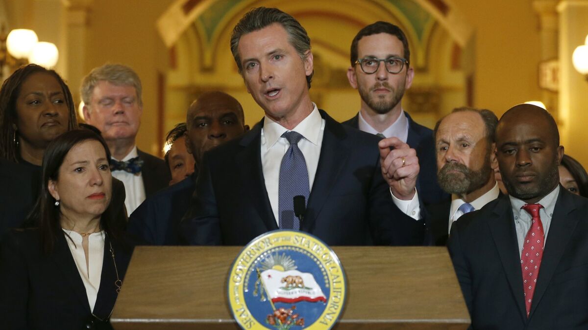 California Gov. Gavin Newsom, pictured at a news conference in March, endorsed Assembly member Todd Gloria for San Diego mayor Tuesday.