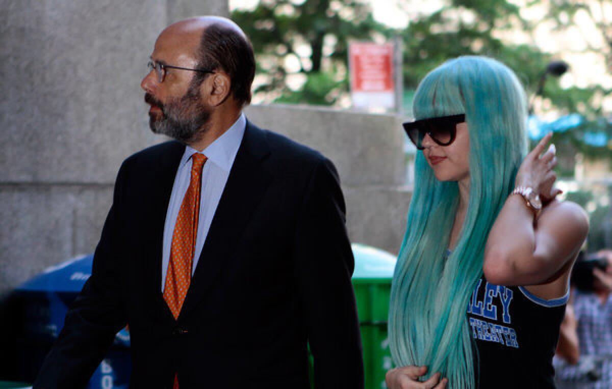Amanda Bynes, accompanied by attorney Gerald Shargel, arrives for a July 9 court appearance in New York on allegations that she chucked a marijuana bong out the window of her 36th-floor Manhattan apartment. Bynes has been hospitalized for a mental health evaluation after deputies said she started a small fire in the driveway of a home in Southern California. Ventura County Sheriff's Capt. Don Aguilar says deputies responding to a call Monday night found Bynes standing next to the flames in the city of Thousand Oaks.