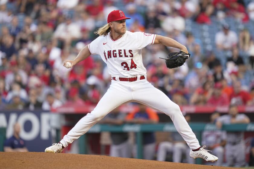 The Angels' Noah Syndergaard pitches during the first inning against the Houston Astros on April 9, 2022.