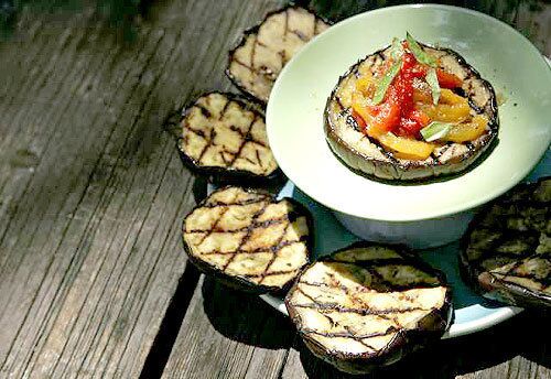 Thick slices of eggplant brushed with olive oil capture a grill's smokiness, while slow-roasted red and yellow peppers add a sweet dimension. Recipe: Grilled eggplant