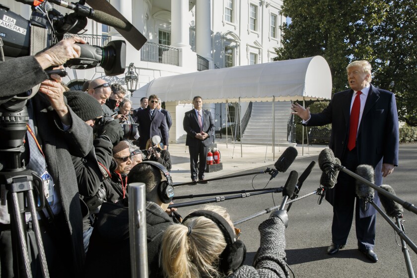 President Trump speaks to reporters Sunday before leaving the White House on a trip to India.