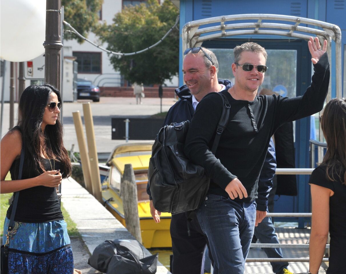 Luciana Barroso and husband Matt Damon board a boat at Venice Lido.