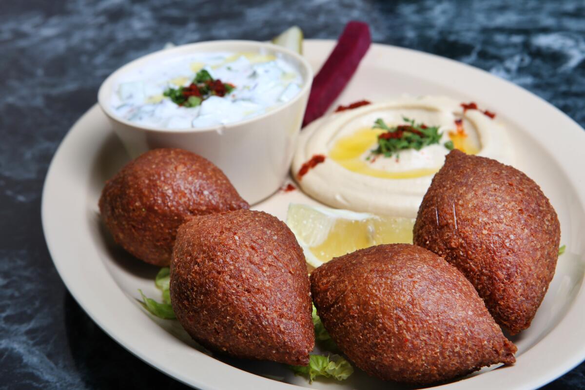 Fried kobee, hummus and yogurt with cucumber at the Kobee Factory & Syrian Kitchen