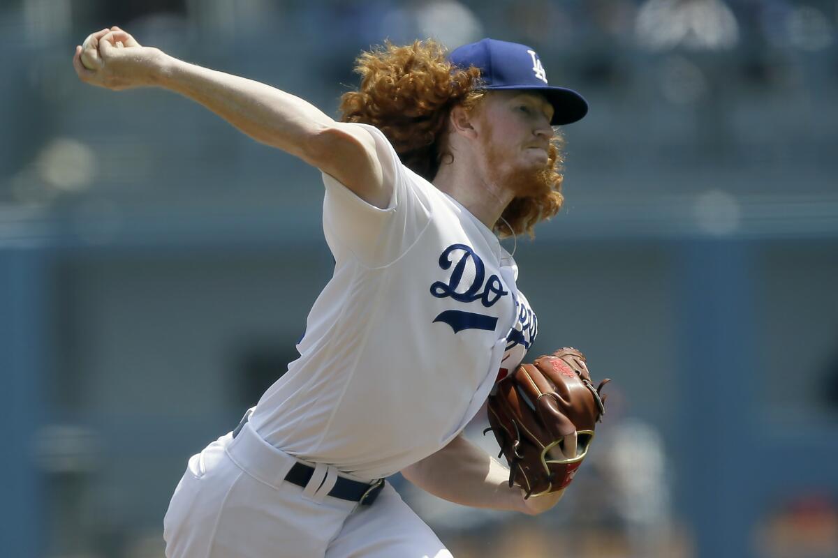 Dodgers pitcher Dustin May throws to a St. Louis Cardinals batter during the first inning on Aug. 7 at Dodger Stadium.