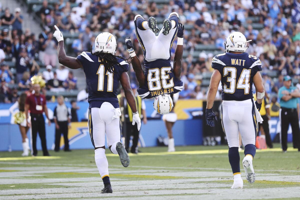 Los Angeles Chargers running back Detrez Newsome (C) does a flip in celebration of his touchdown as Los Angeles Chargers wide receiver Geremy Davis (L) and Los Angeles Chargers fullback Derek Watt (R) join him for the celebration during the NFL American Football game between the New Orleans Saints and Los Angeles Chargers at the StubHub Center in Carson, California, USA, 25 August 2018.