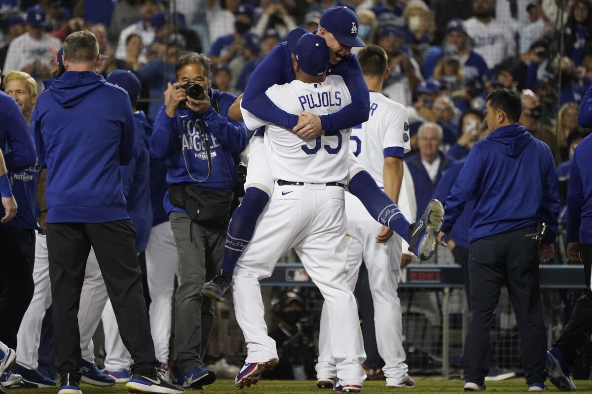The Los Angeles Dodgers celebrate after Chris Taylor 