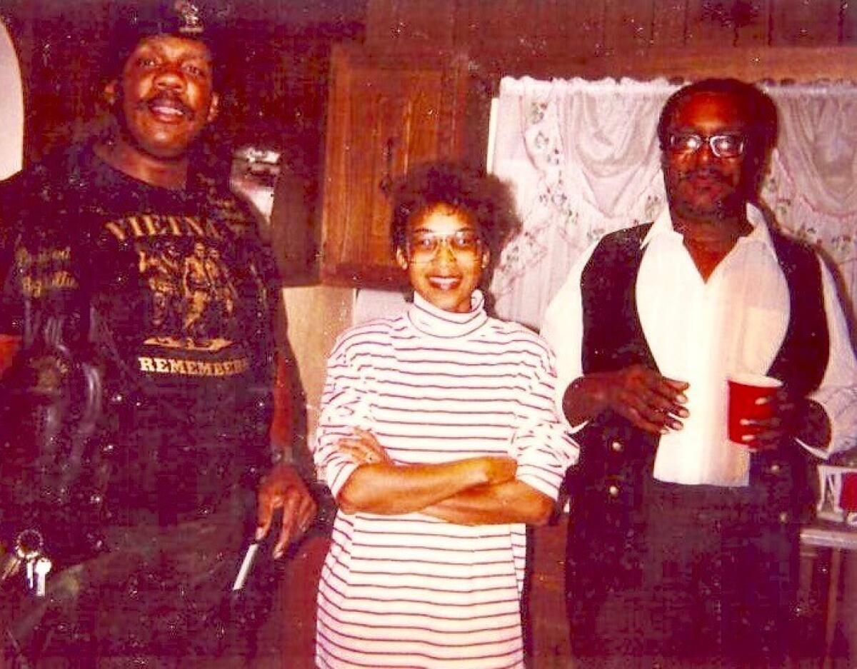 Big Willie, left, smiles with his sister Jean Davis-Hatcher and brother Don Ray Robinson at the street racer's home. (Courtesy of Jean Davis-Hatcher)