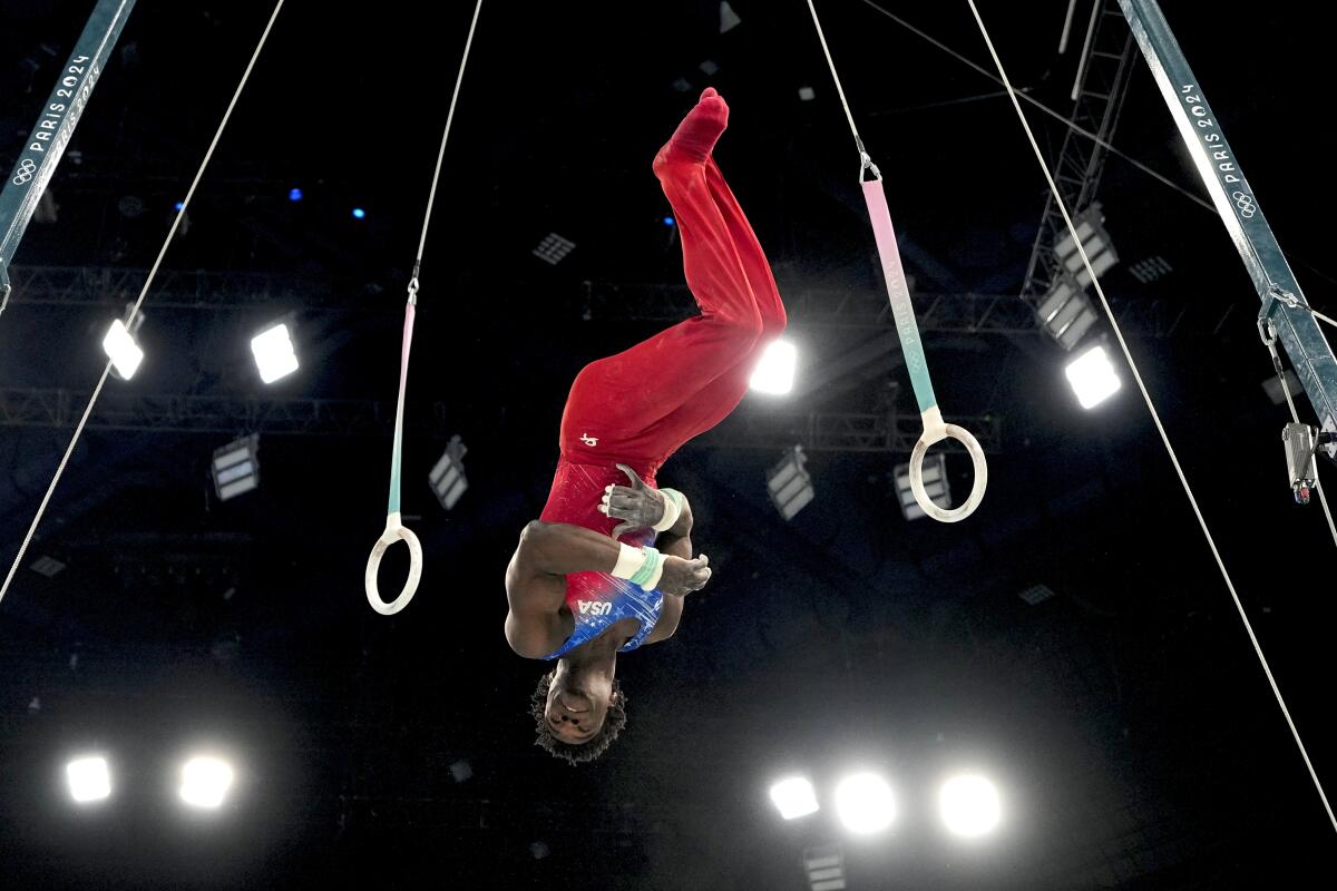 Frederick Richard, of the United States, performs on the rings during the men's gymnastics all-around finals