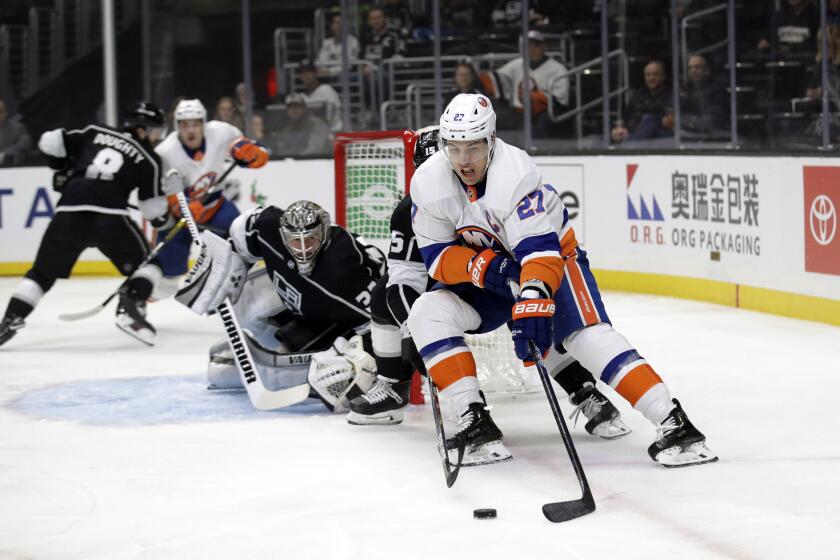 New York Islanders' Anders Lee (27) controls the puck near the Los Angeles Kings goal during the first period of an NHL hockey game Wednesday, Nov. 27, 2019, in Los Angeles. (AP Photo/Marcio Jose Sanchez)