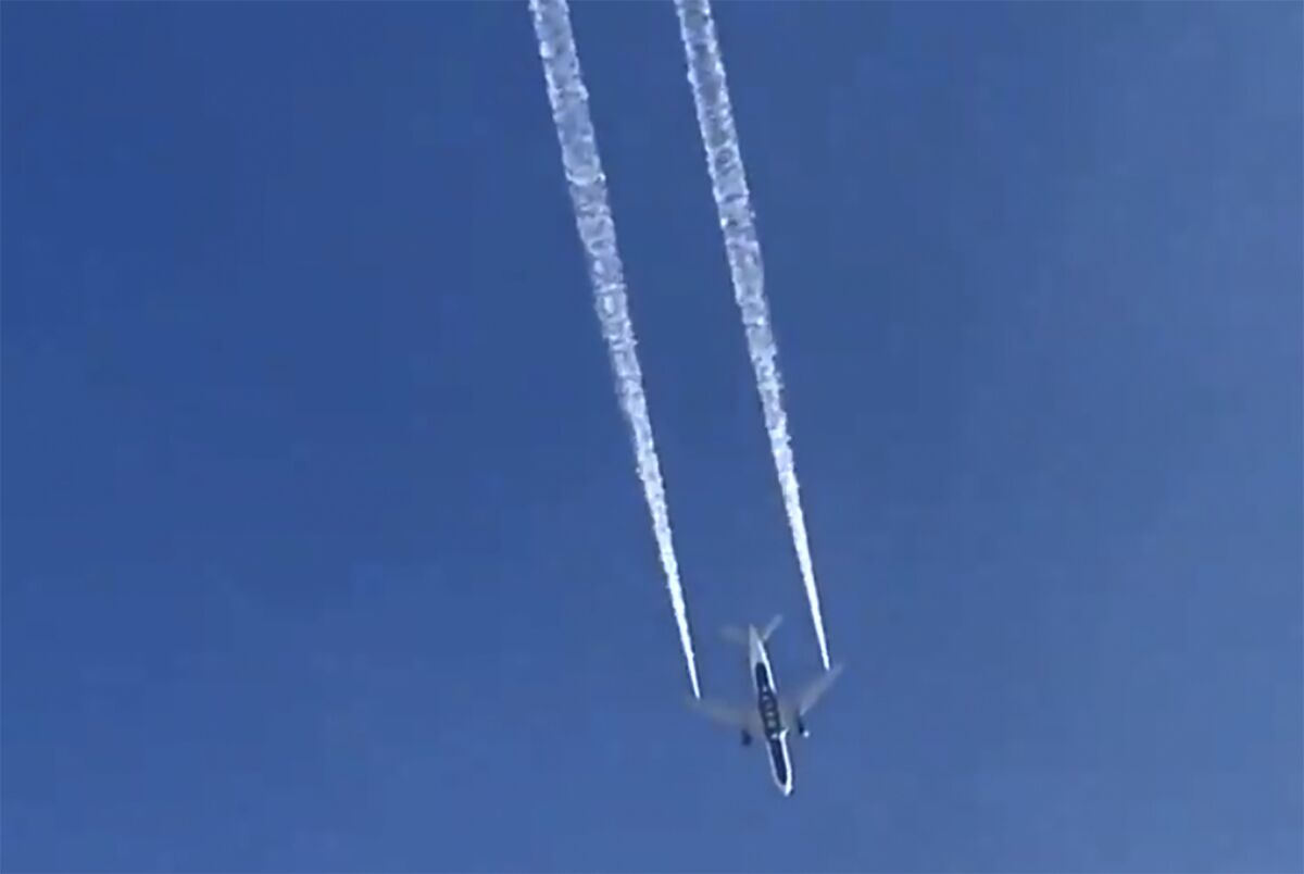 In this image from video, Delta Air Lines Flight 89 to Shanghai, China dumps fuel over Los Angeles before returning to Los Angeles International Airport for an emergency landing.