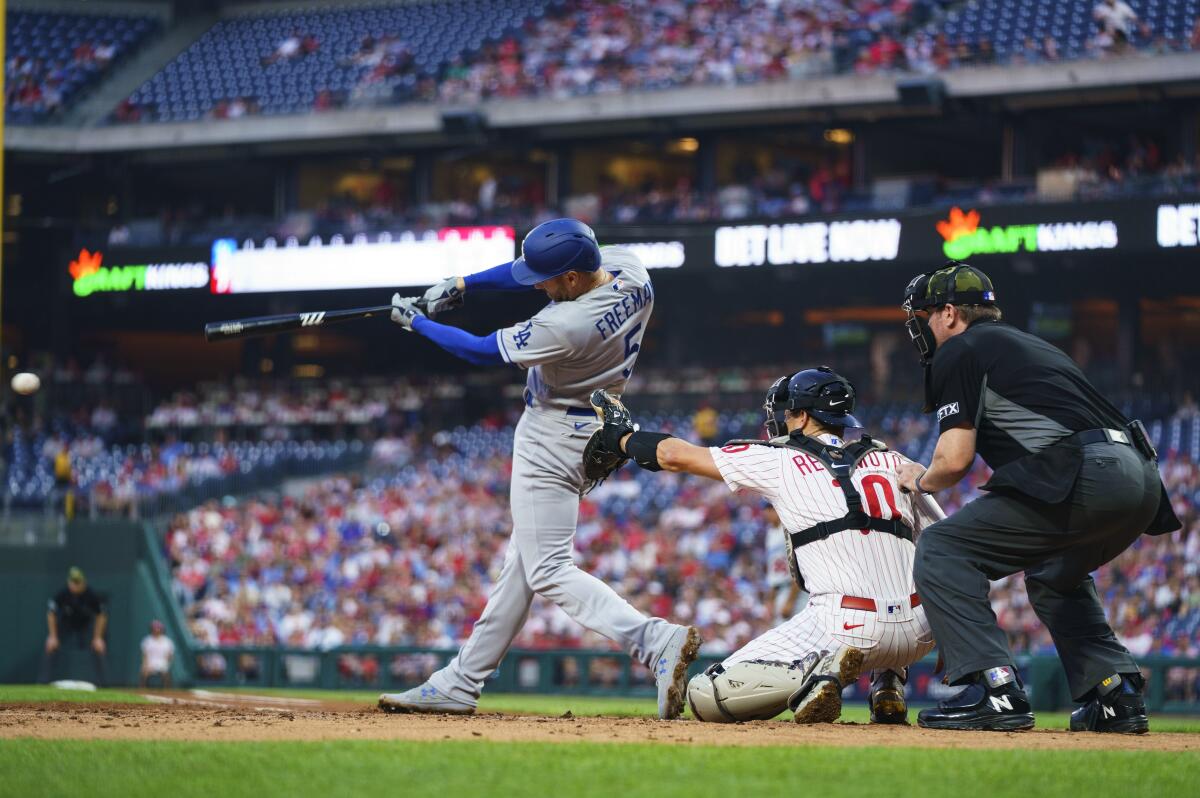 Dodgers first baseman Freddie Freeman hits a two-run single during the second inning Friday.