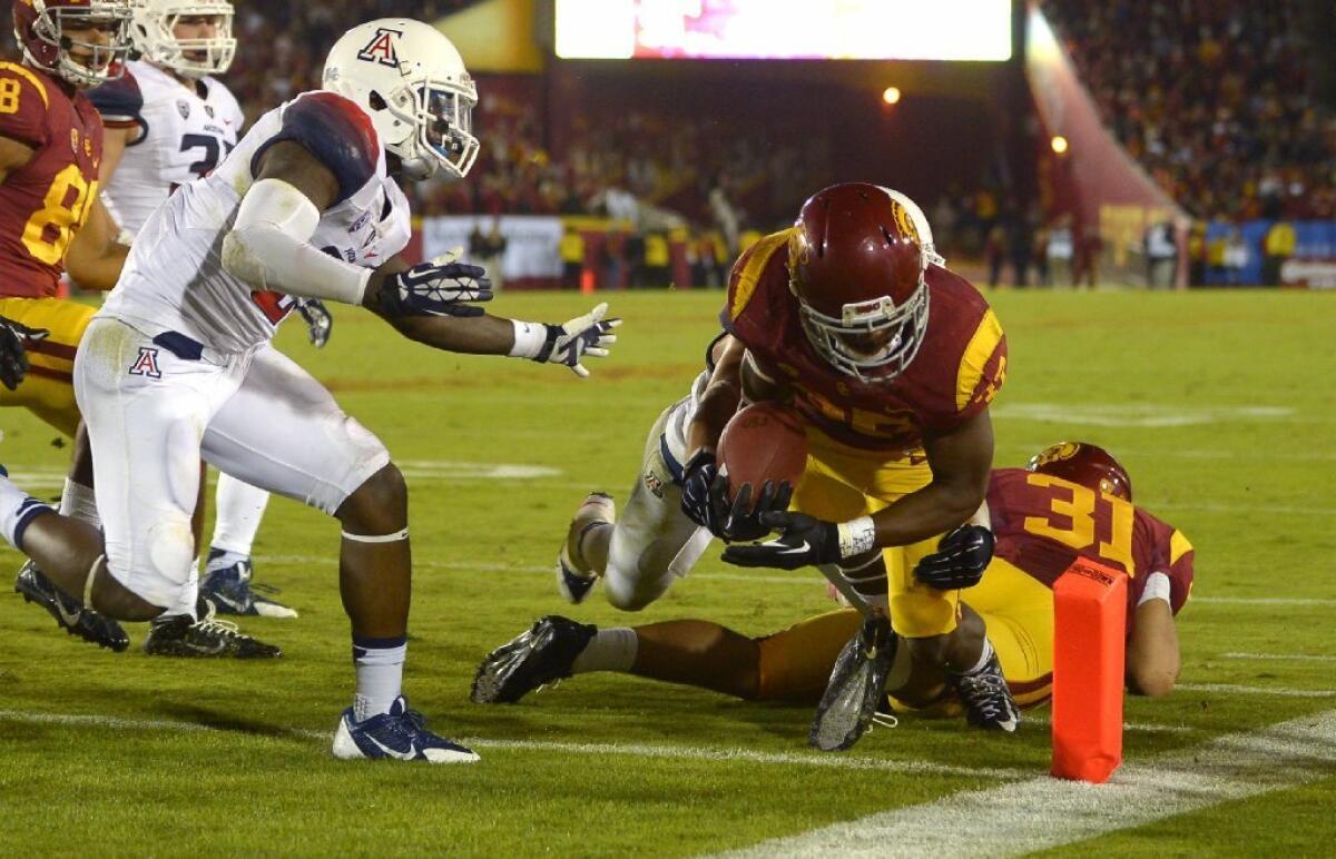 Javorius Allen dives in for a touchdown during USC's win over Arizona.