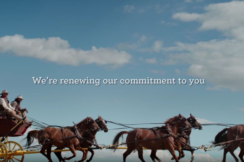 A stagecoach thunders across the landscape in this Wells Fargo image ad. But what has the company really fixed?