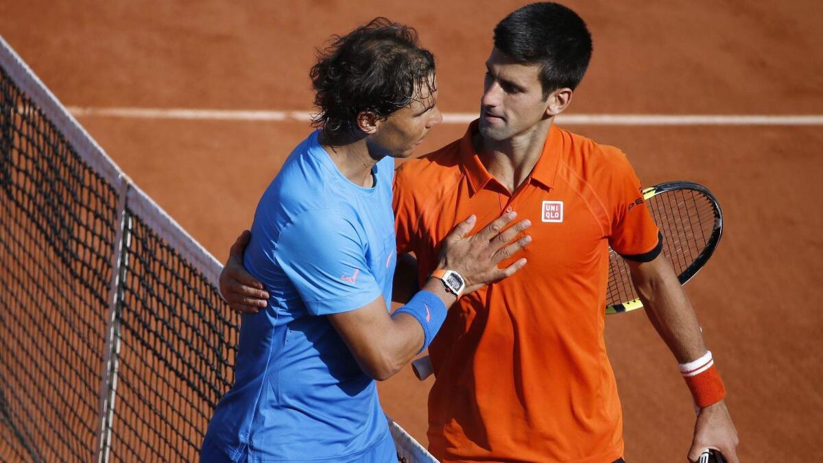 Tennis-Men's 'Big Three' in same half of French Open draw