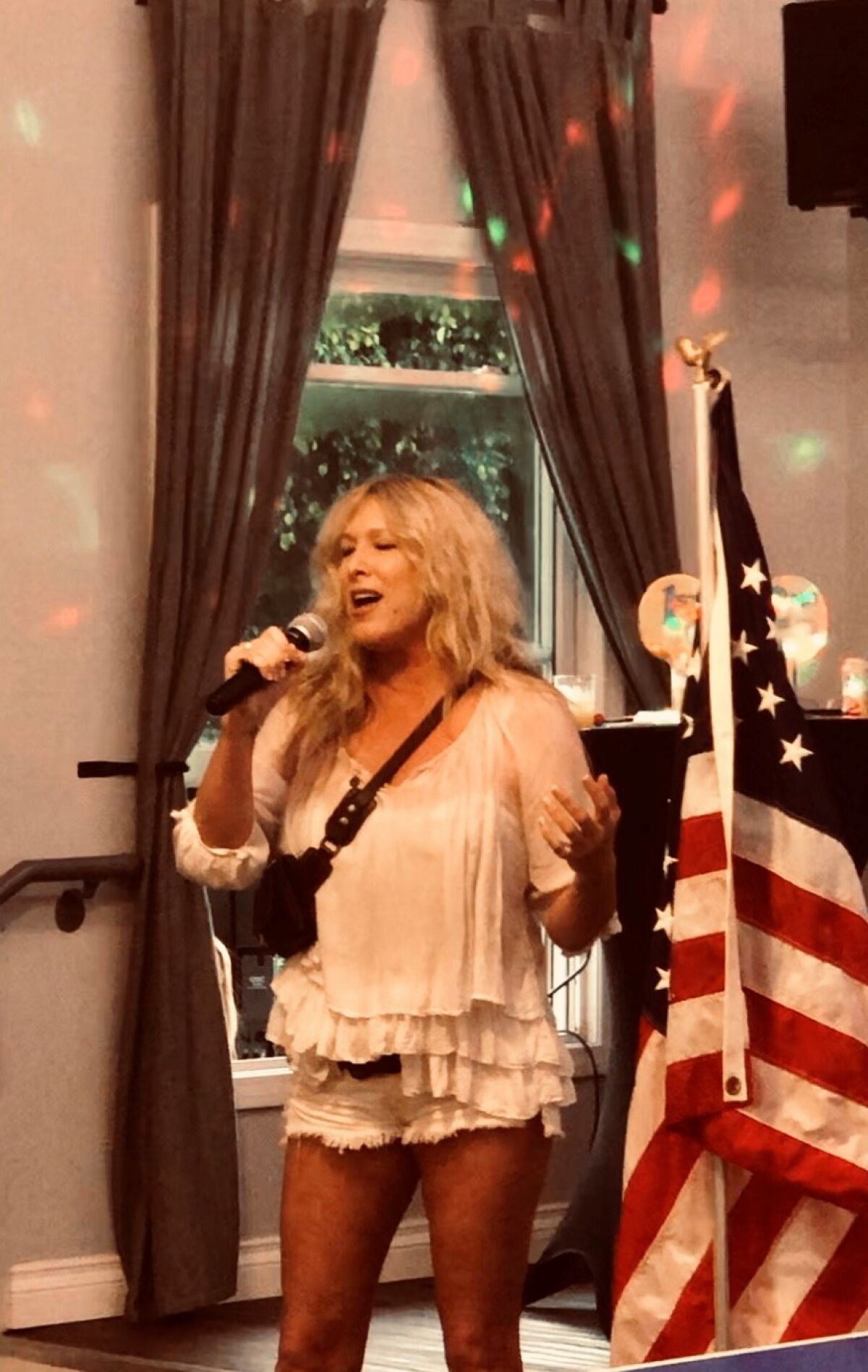 Lacy Younger sings the National Anthem before the tournament begins — a ‘goosebump moment,’ said club member Susan Winkie.