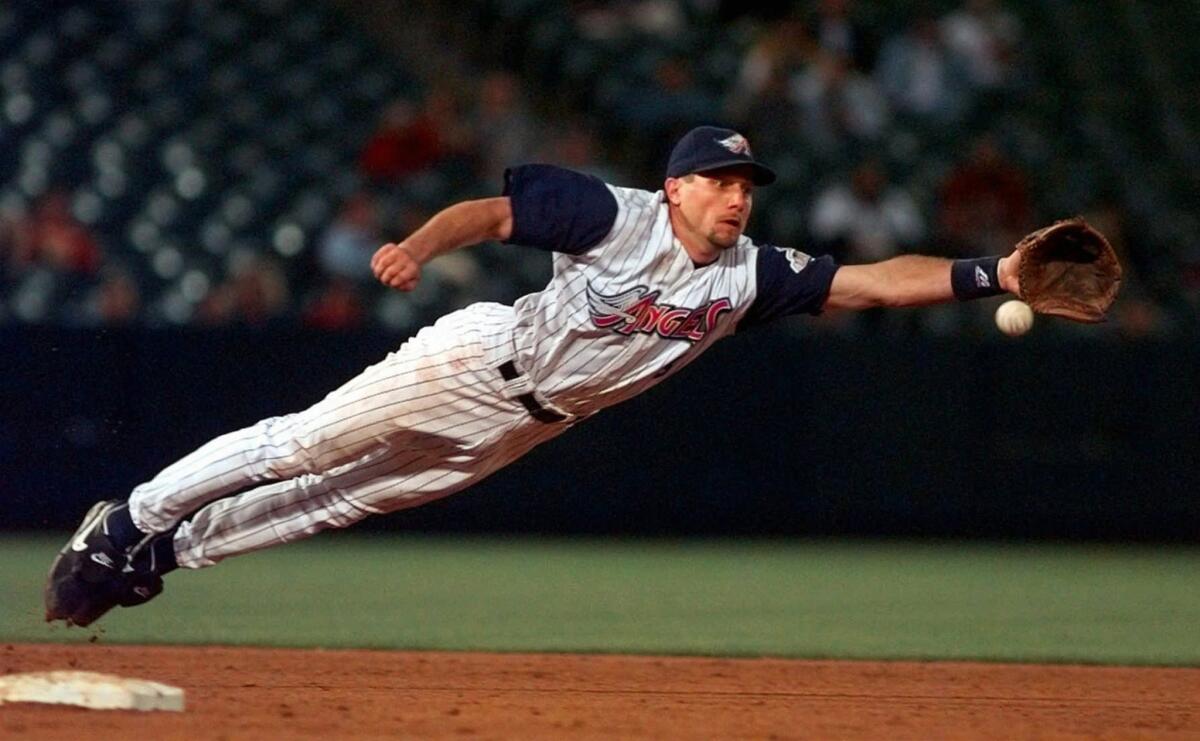 Gary DiSarcina, shown playing shortstop for the Angels in 1998, has been hired as the team's third-base coach.