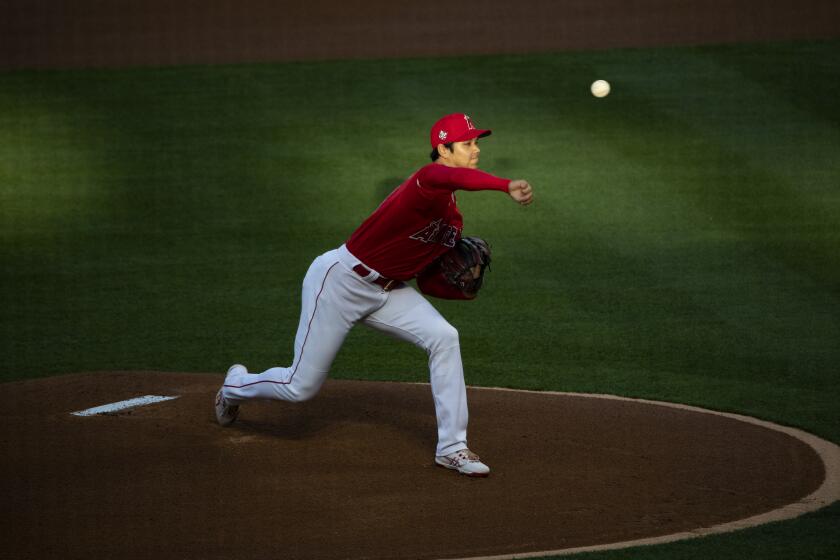 ANAHEIM, CA - APRIL 20, 2021: Los Angeles Angels starting pitcher Shohei Ohtani (17) walked 3 batters in the first inning, but managed to get out of the jam against the Texas Rangers at Angel Stadium on April 20, 2021 in Santa Ana California.(Gina Ferazzi / Los Angeles Times)