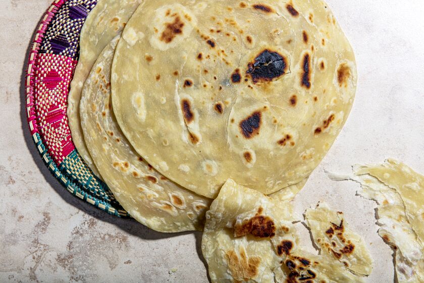 LOS ANGELES, CALIFORNIA, Dec. 11, 2020: A part of food video-producer and cook Kiano MojuOs Christmas menu: Chapati bread preapared for her Rolex (Chapati rolled around eggs and veggies) photographed on Friday, Dec. 11, 2020, at Jikoni Studio, a creative culinary space owned by Moju, in Arts District Los Angeles. (Silvia Razgova / For the Times, food and prop styling by Kiano Moju) ATTN: 666808-la-fo-Kiano-Moju-Christmas