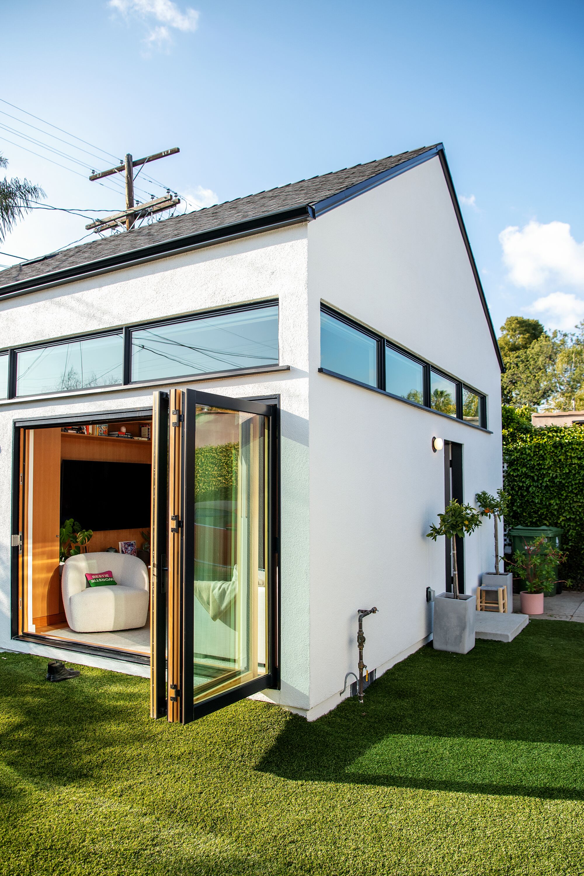 A bifold door on the ADU opens to the backyard.