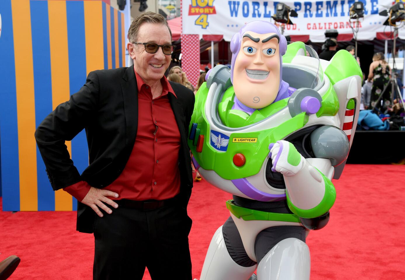 Tim Allen poses with Buzz Lightyear at the premiere of Disney and Pixar's "Toy Story 4" on June 11, 2019, in Los Angeles, California.