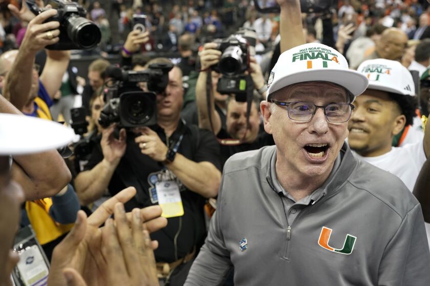 Miami head coach Jim Larranaga celebrates after their win against Texas in an Elite 8 college basketball game in the Midwest Regional of the NCAA Tournament Sunday, March 26, 2023, in Kansas City, Mo. (AP Photo/Charlie Riedel)
