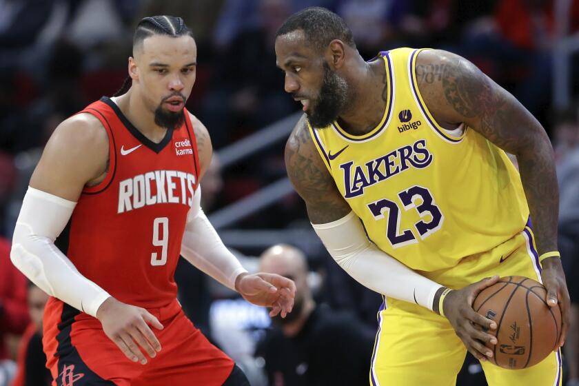 Los Angeles Lakers forward LeBron James (23) looks to get past Houston Rockets forward Dillon Brooks.