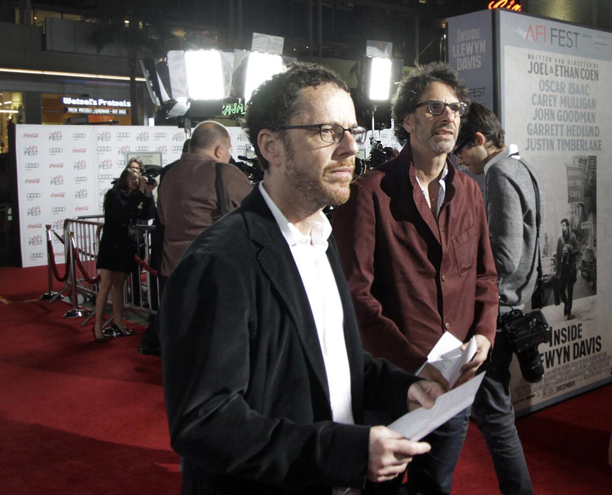 Joel and Ethan Coen will reportedly write the screenplay for a Steven Spielberg-directed Cold War thriller starring Tom Hanks. Above, the filmmaker brothers, with Ethan at left, at the premiere last fall of "Inside Llewyn Davis."