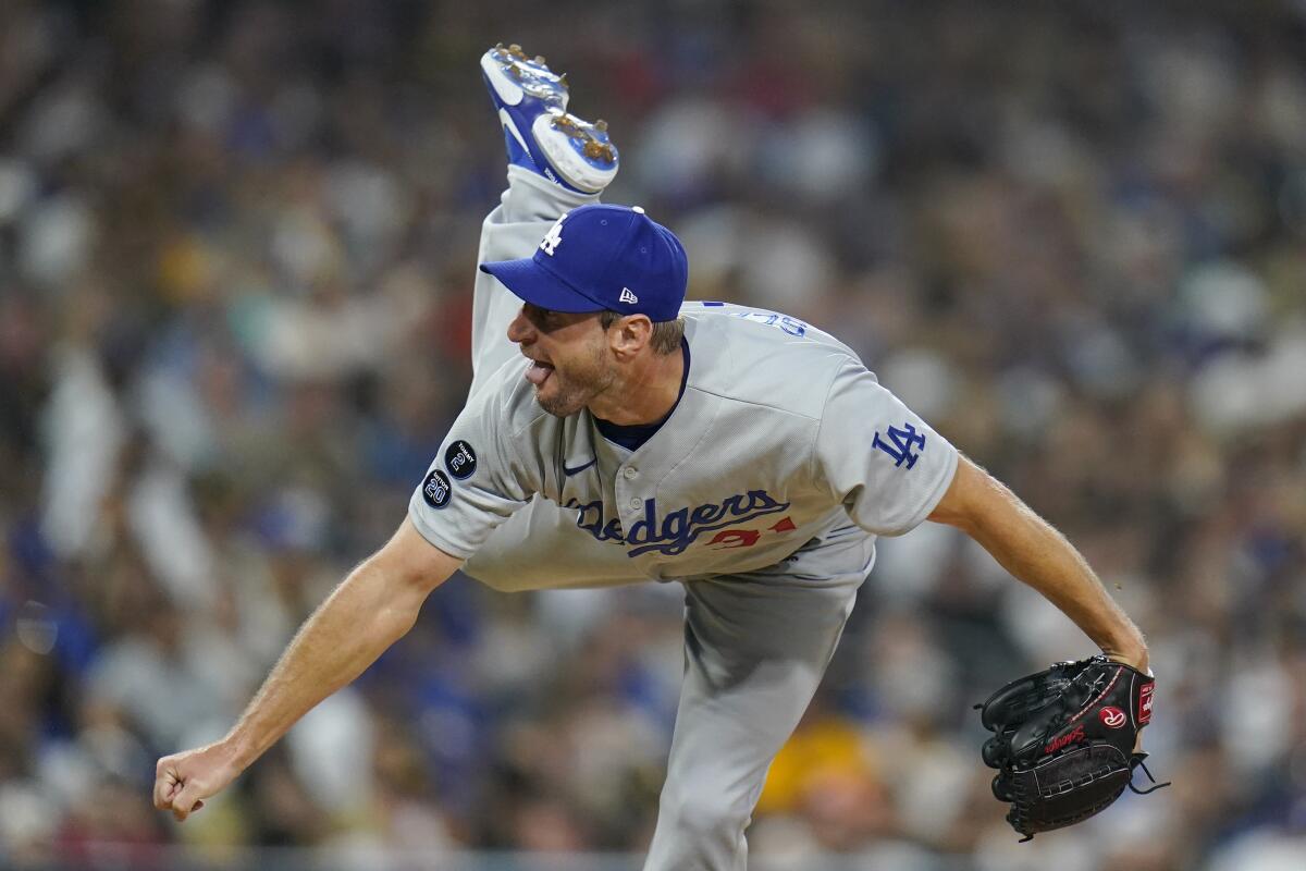 Los Angeles Dodgers starting pitcher Max Scherzer works against a San Diego Padres batter.