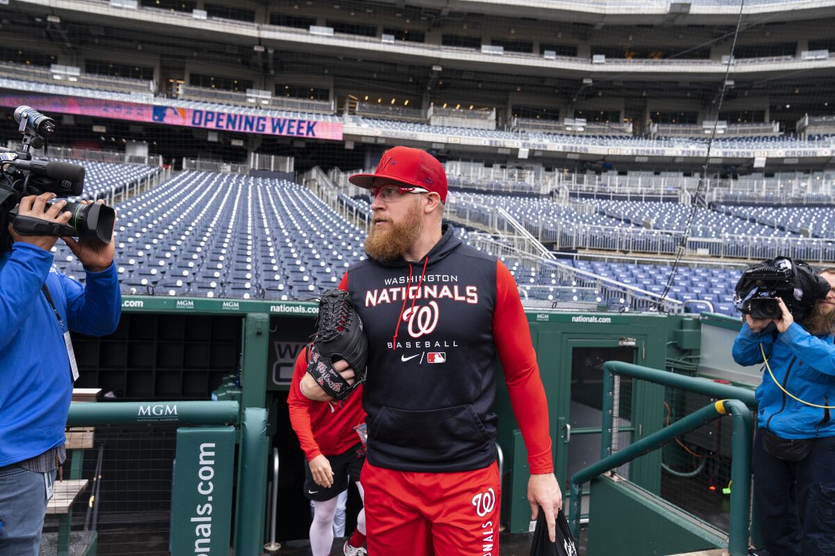 Washington Nationals relief pitcher Sean Doolittle takes the field for a baseball workout at Nationals Park, Wednesday, April 6, 2022, in Washington. The Washington Nationals and the New York Mets are scheduled to play on opening day, Thursday. (AP Photo/Alex Brandon)