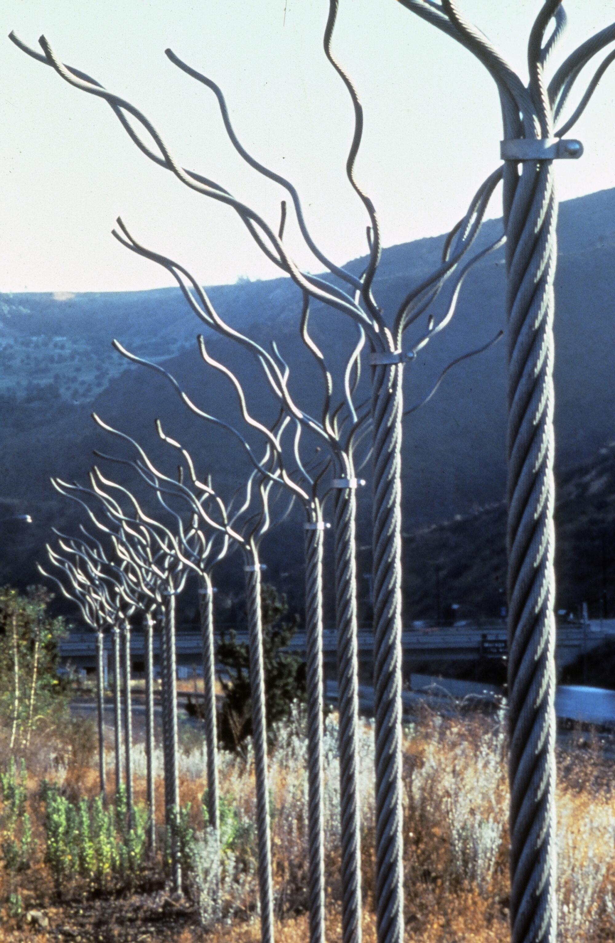 Maren Hassinger‘s “Twelve Trees” (1979) installed along the Los Angeles highway
