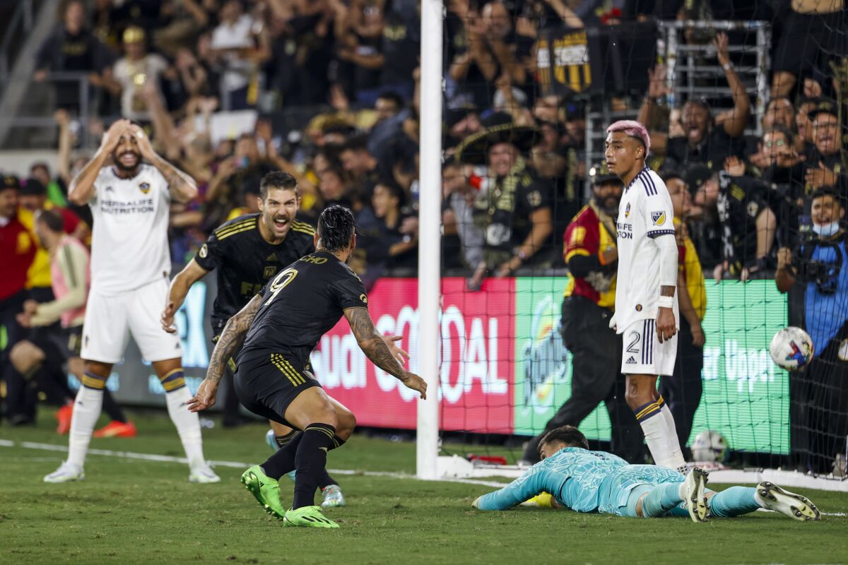 Cristian Arango and Franco Escobar celebrate a goal.
