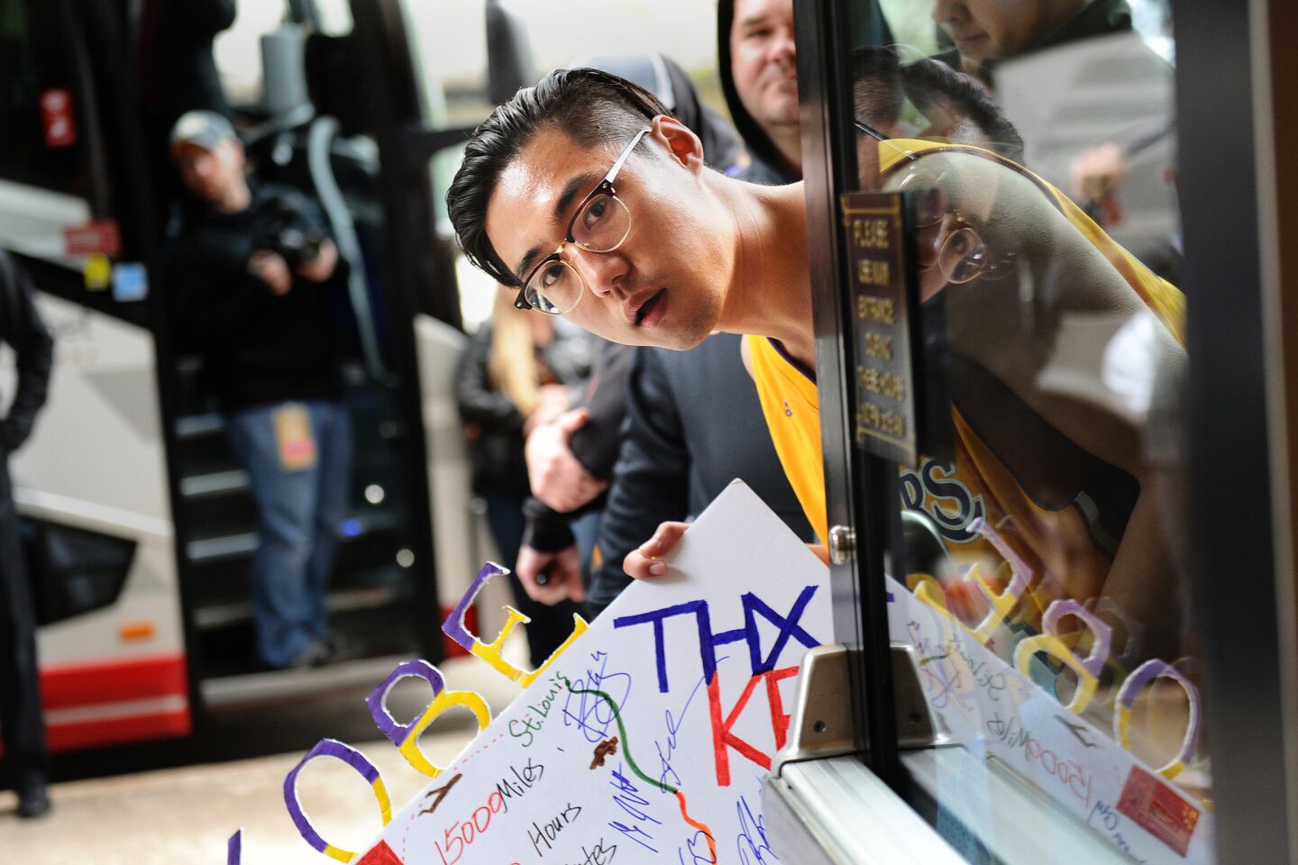 Fans wait for Lakers Kobe Bryant outside the Skirvin Hilton before he boards the bus in Oklahoma City.