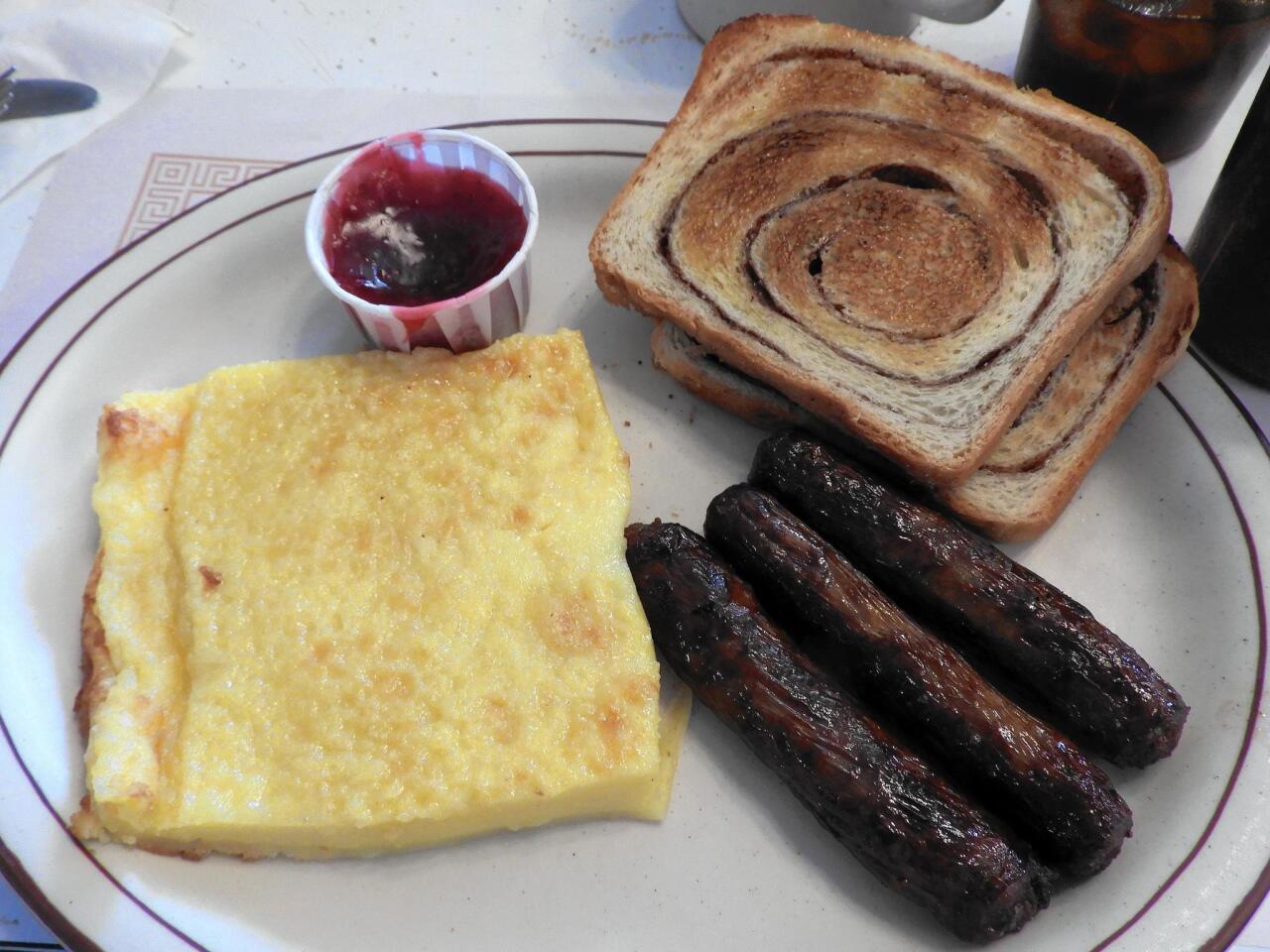 A pancake called pannukakku and a toasted bread called nisu are among the Finnish foods served at breakfast time at Suomi Home Bakery & Restaurant in Houghton, Mich.