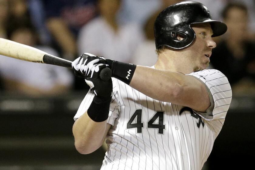 Slugger Adam Dunn delivers a run-scoring double against Cleveland in one of his final games for the White Sox last week.