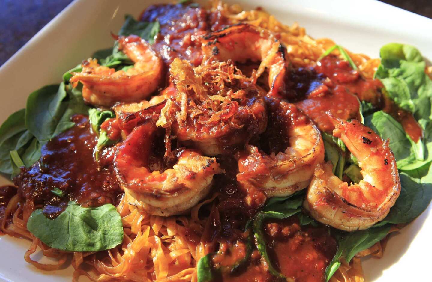 Dan's special garlic noodles with grilled prawns is a favorite.