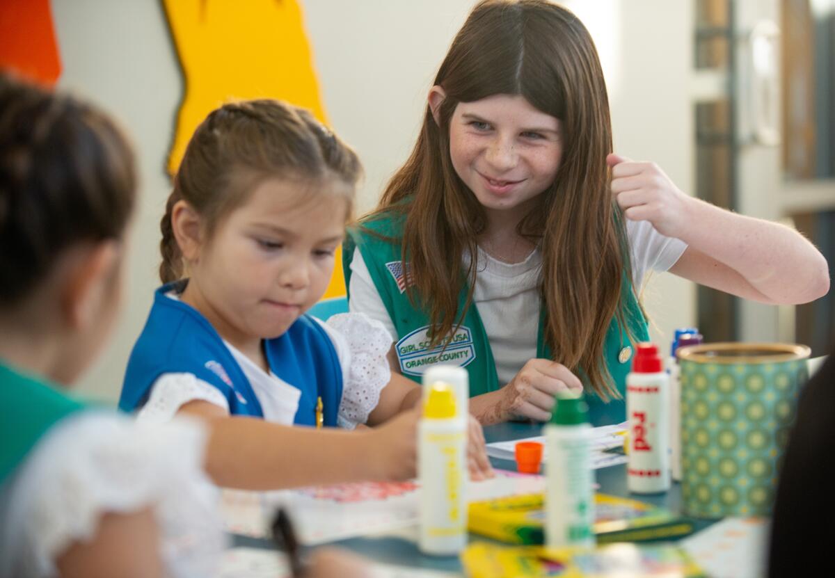 Girl Scouts create signs to advertise cookies Friday, Jan. 20 in Newport Beach