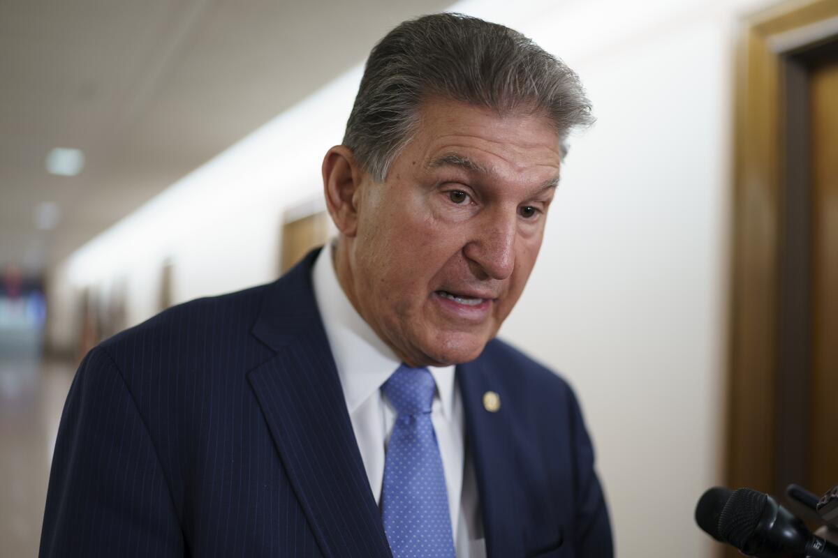 FILE - In this June 23, 2021, file photo Sen. Joe Manchin, D-W.Va., chairman of the Senate Energy and Natural Resources Committee, talks to reporters at the Capitol in Washington. Top congressional Democrats are hunting for the sweet spot that would satisfy the party’s rival moderate and progressive wings, a crucial moment as they craft legislation financing President Joe Biden’s multi-trillion dollar agenda of bolstering the economy and helping families.(AP Photo/J. Scott Applewhite, File)