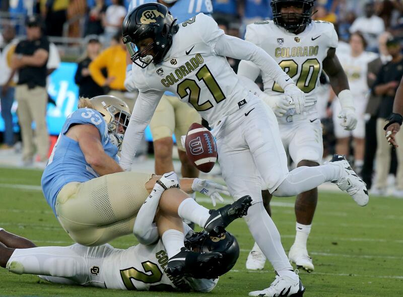 UCLA running back Carson Steele fumbles after a big hit by Colorado safety Shilo Sanders in the second quarter.