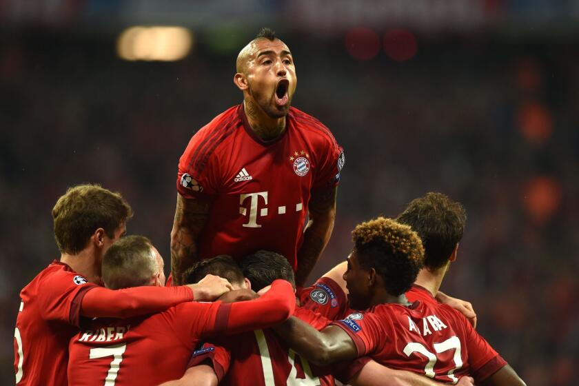 Bayern Munich midfielder Arturo Vidal celebrates with teammates after a goal against Atletico Madrid on May 3.