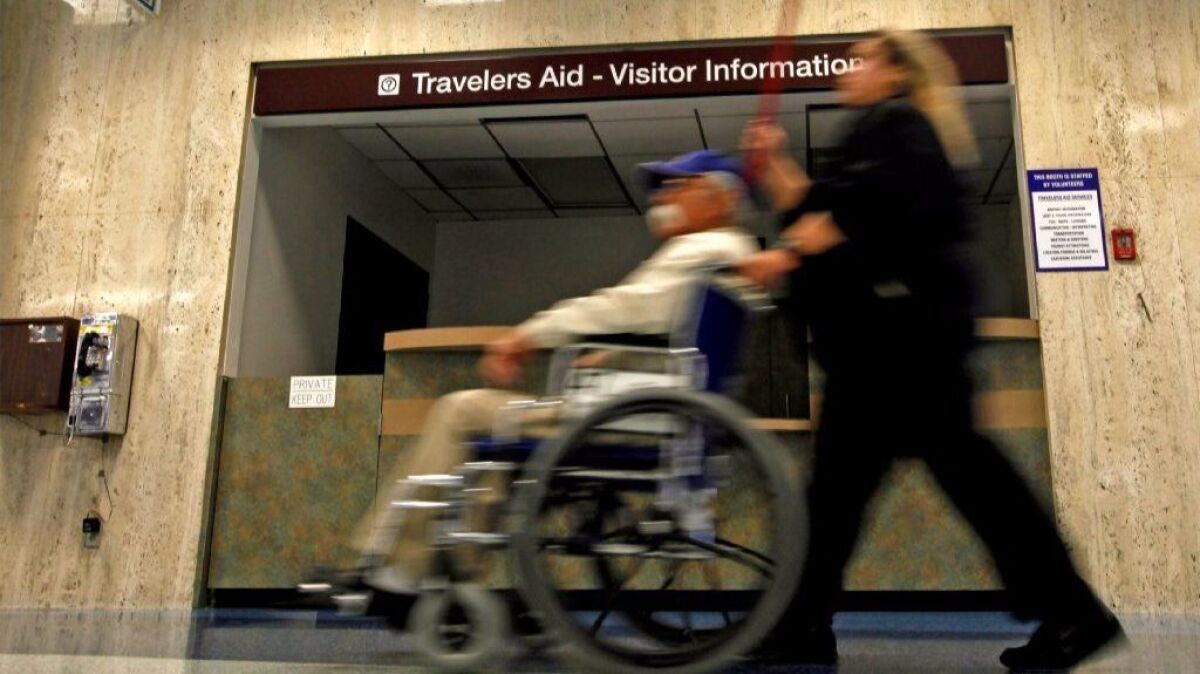A traveler in a wheelchair at Los Angeles International Airport. The U.S. Transportation Department has delayed implementing a rule to force airlines to keep track of passenger wheelchairs.