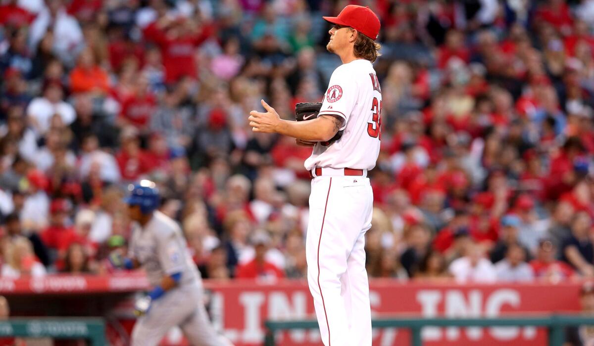 Jered Weaver waits for Royals catcher Salvador Perez to circle the bases after hitting a two-run home run in the fourth inning Saturday night.