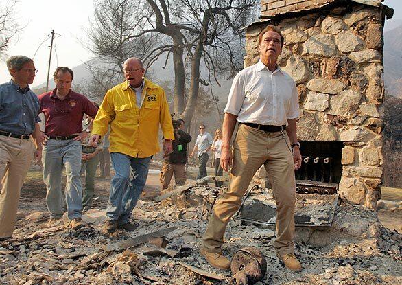Gov. Arnold Schwarzenegger tours the devastation caused by the Station fire to the small mountain community of Vogel Flats in Tujunga.