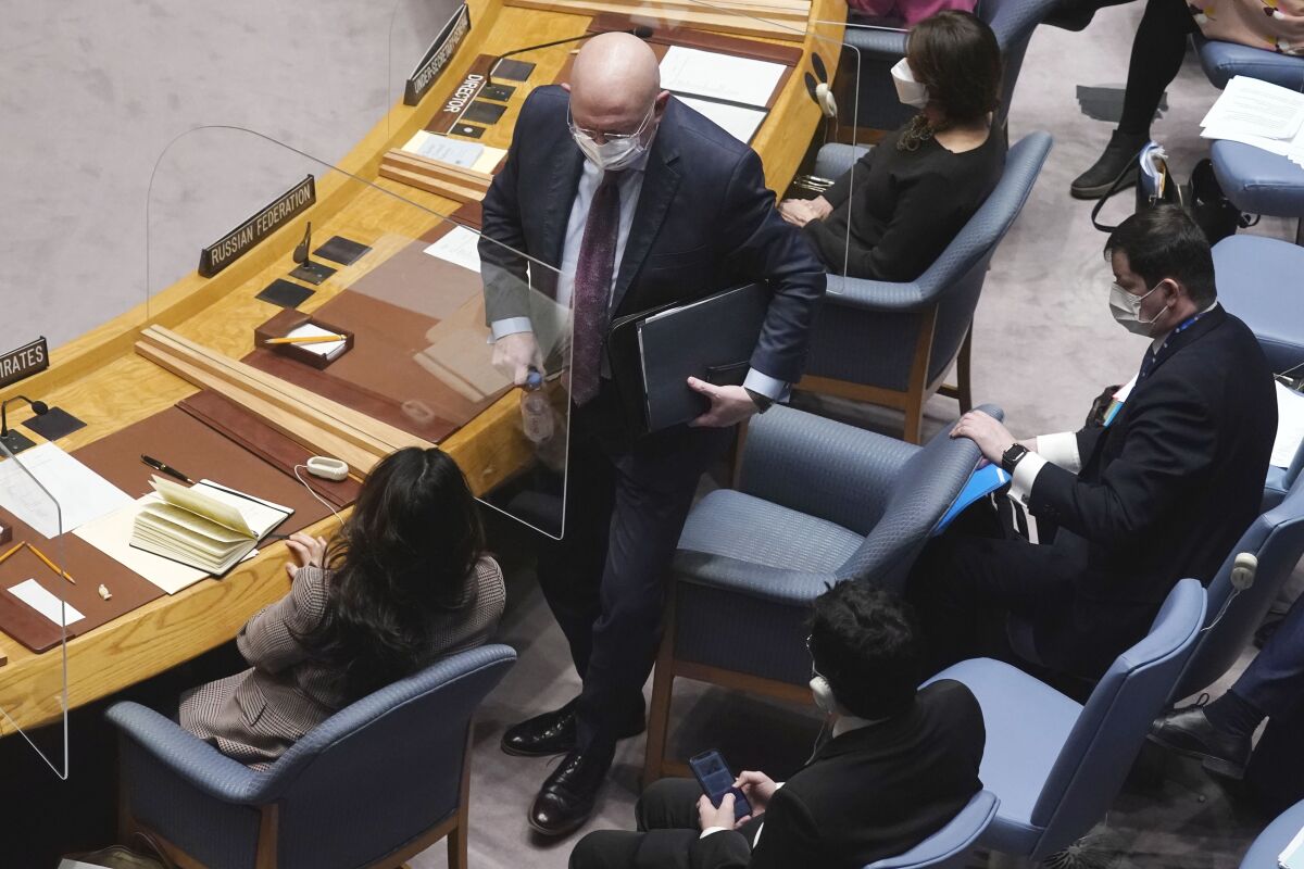 Russia's U.N. Ambassador Vassily Nebenzia leaves the Security Council conference table