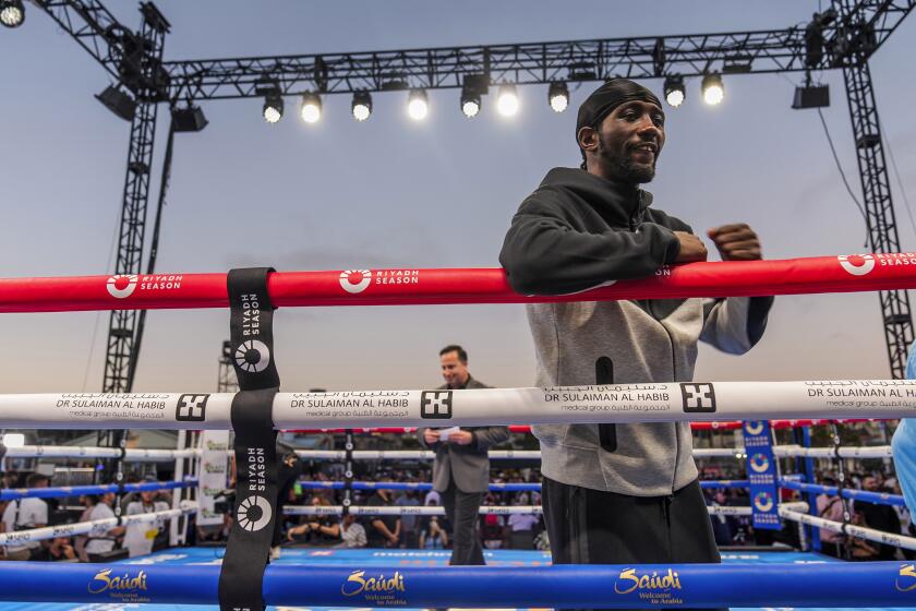 American boxer Terence Crawford poses for a picture after conducting a public workout at the Santa Monica Pier on Wednesday, July 31, 2024, in Santa Monica, Calif. Terence Crawford will face Israil Madrimov on Saturday, Aug. 3 at the BMO Stadium in Los Angeles. (AP Photo/Damian Dovarganes)